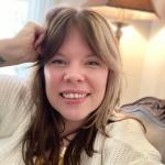 Image of Brandy, a cisgender white woman, smiling 