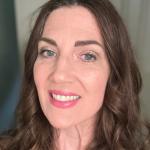 White female in her 50s with long brown hair
